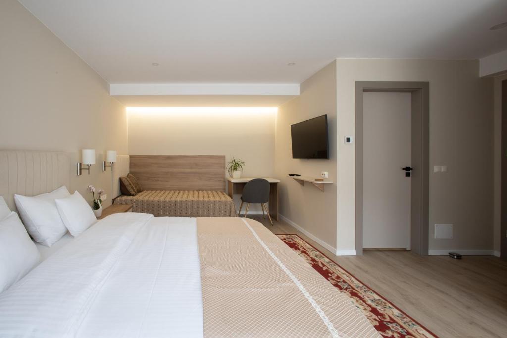 Postel nebo postele na pokoji v ubytování CASA ENCIAN