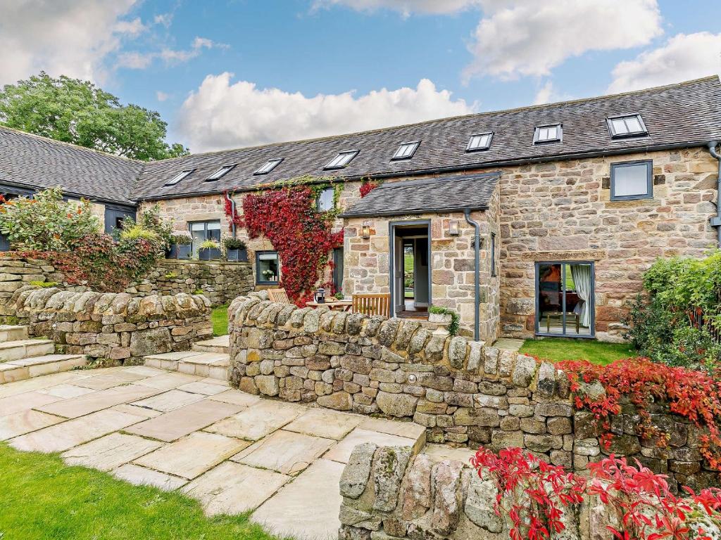 a stone house with a stone wall at 1 Bed in Riber 93436 in Matlock Bank