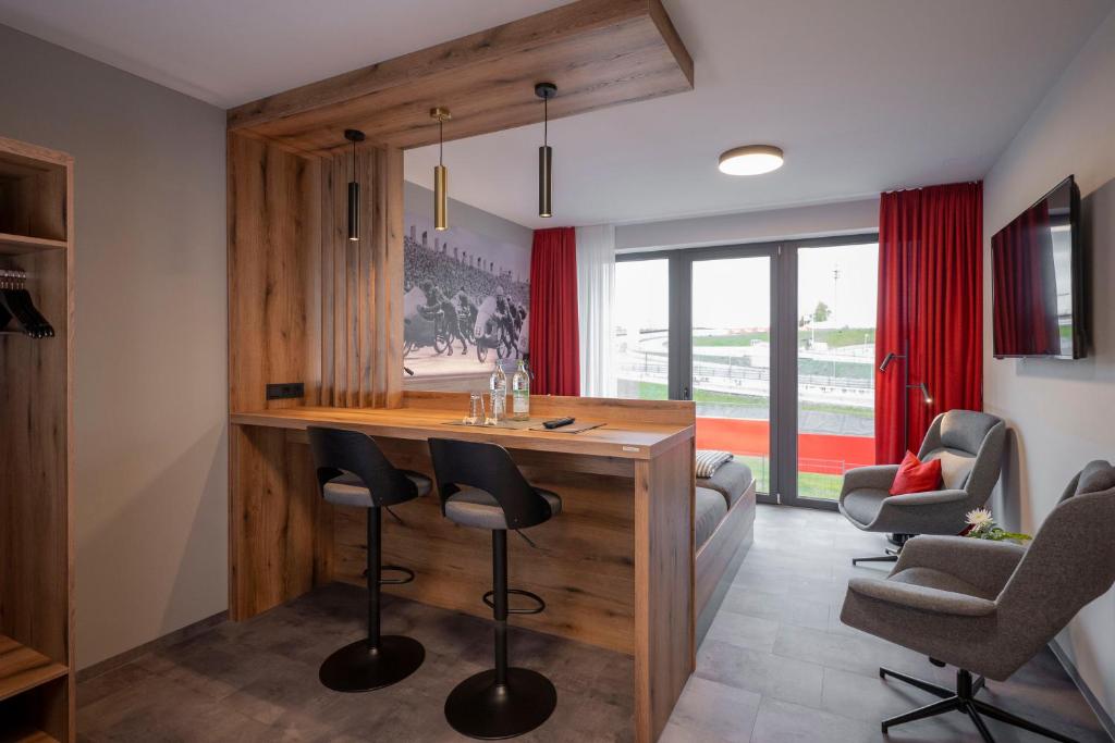 TV a/nebo společenská místnost v ubytování Quartier am Sachsenring
