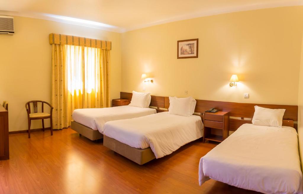Uma cama ou camas num quarto em Hotel Belsol