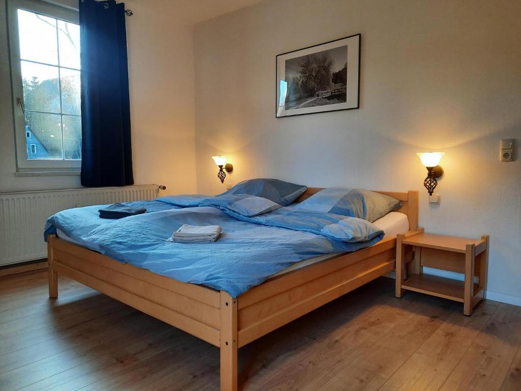 Postel nebo postele na pokoji v ubytování Pension am Bach
