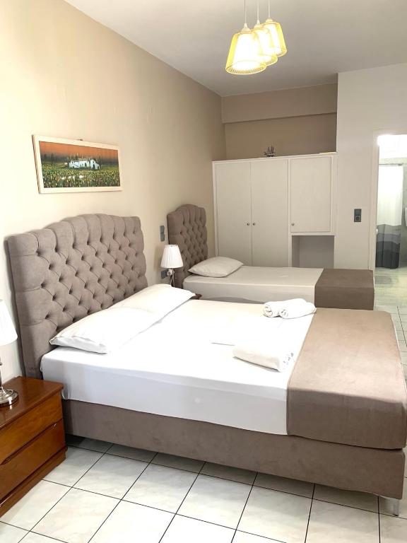 Postel nebo postele na pokoji v ubytování Chrysa House