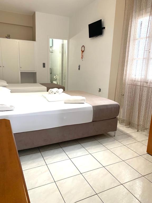Postel nebo postele na pokoji v ubytování Chrysa House