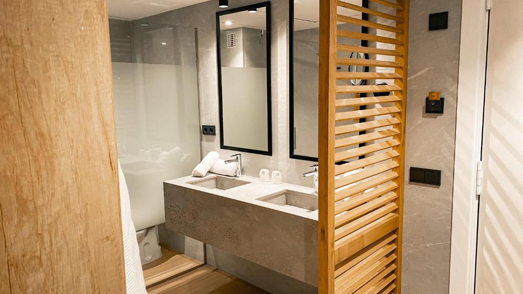 a bathroom with a sink and a mirror at htop Amatista #htopBliss in Lloret de Mar