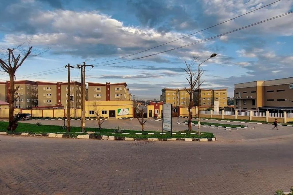 an empty street in a city with buildings at Vim 2-BR-Apt With Fast Unlimited Internet & 24HRS Power in Lagos