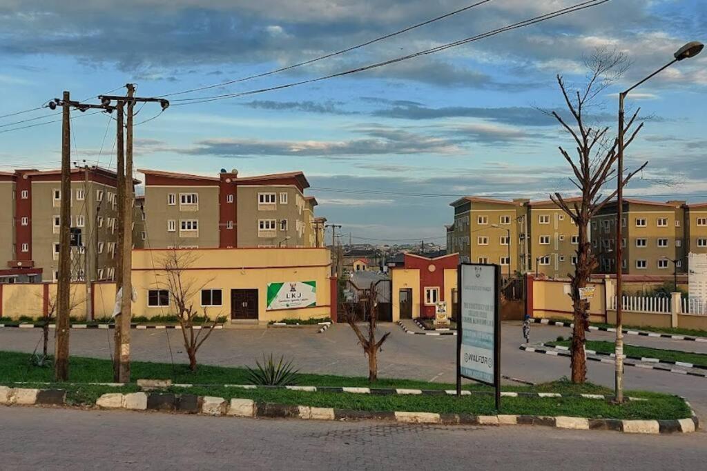 a city with buildings and a street with a sign at Vim 2-BR-Apt With Fast Unlimited Internet & 24HRS Power in Lagos