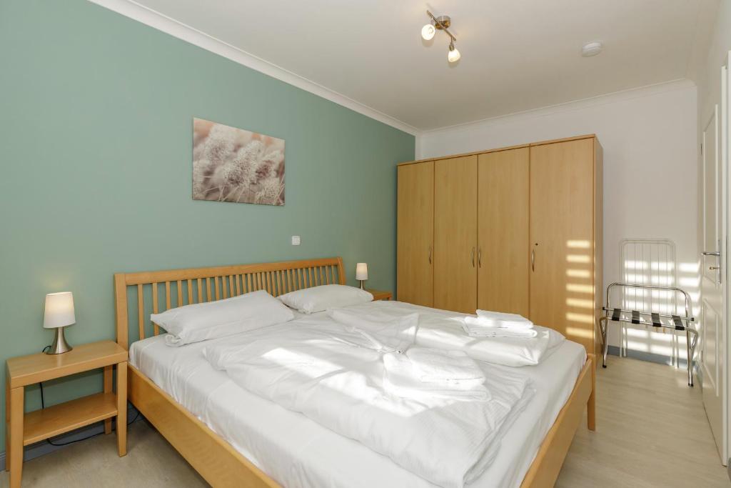 Postel nebo postele na pokoji v ubytování Apartment-Residenz Ostseestrand Apartment-Residenz Ostseestrand 21