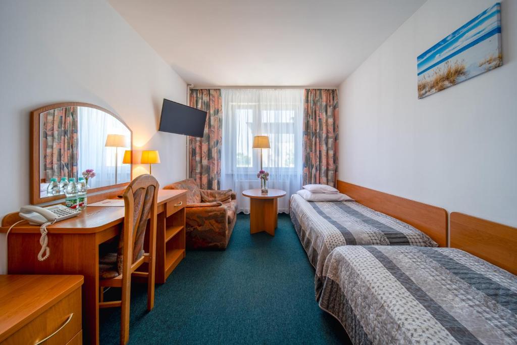 Posteľ alebo postele v izbe v ubytovaní Hotel Gromada Medical SPA Busko Zdrój