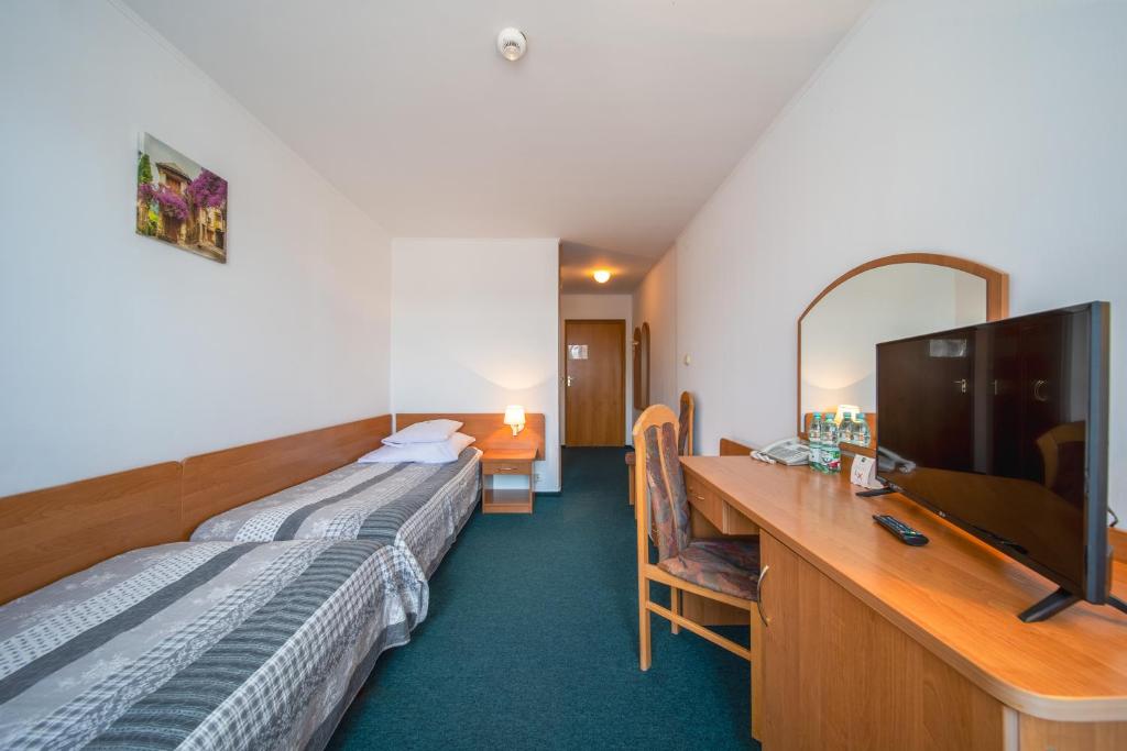 Televízia a/alebo spoločenská miestnosť v ubytovaní Hotel Gromada Medical SPA Busko Zdrój