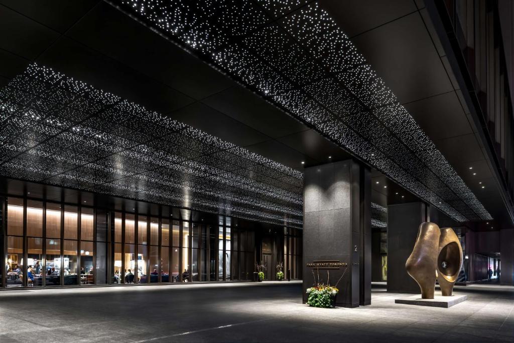 a rendering of the lobby of a building with lights at Park Hyatt Toronto in Toronto