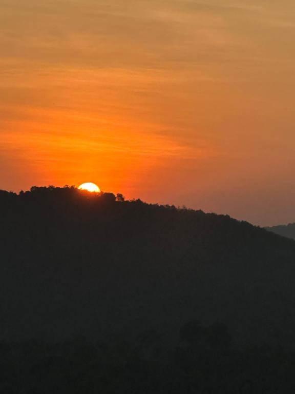 The sunrise or sunset as seen from a panziókat or nearby