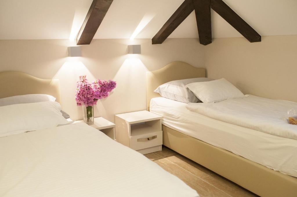 Postel nebo postele na pokoji v ubytování Hotel Konavle