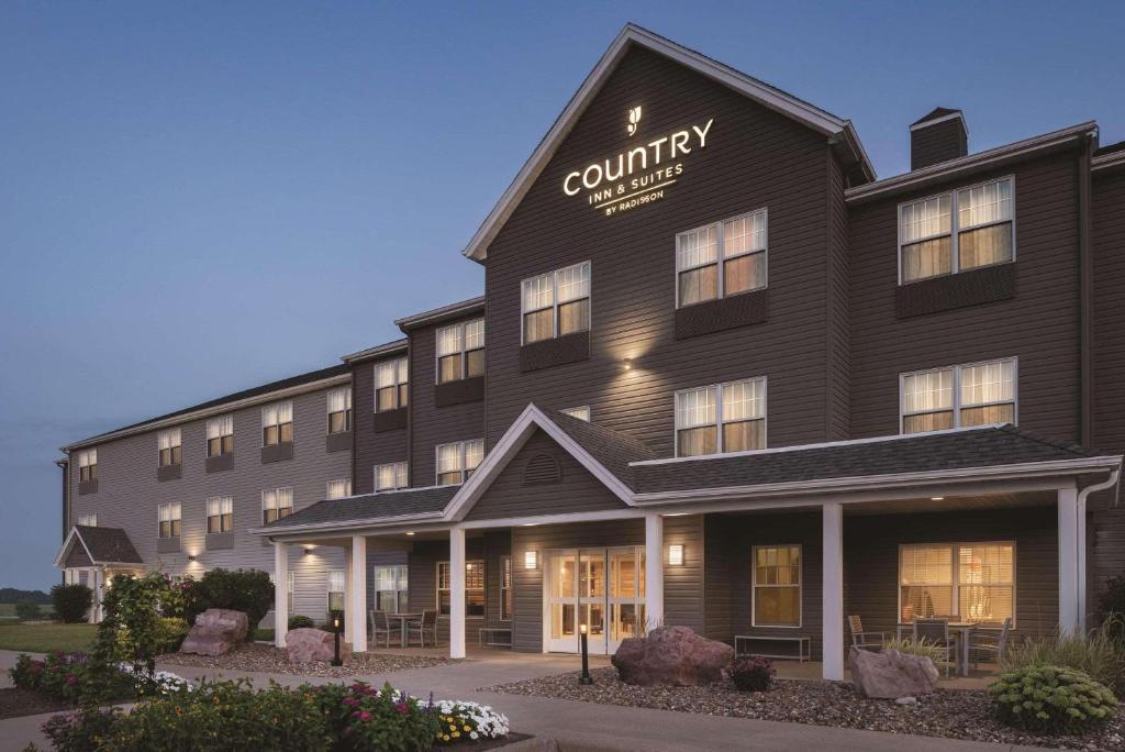 a rendering of a hotel with a building at Country Inn & Suites by Radisson, Pella, IA in Pella