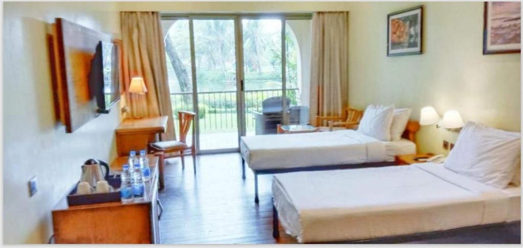 Ibiza The Fern Resort & Spa, Kolkata - Queen Room Mit Gartenansicht