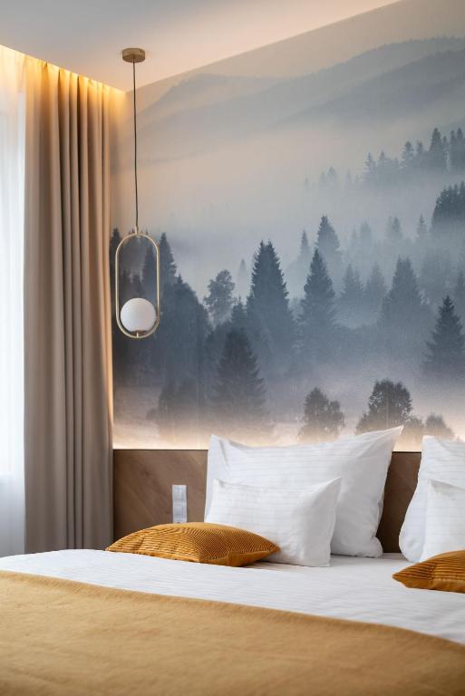 Postel nebo postele na pokoji v ubytování Resort Český les