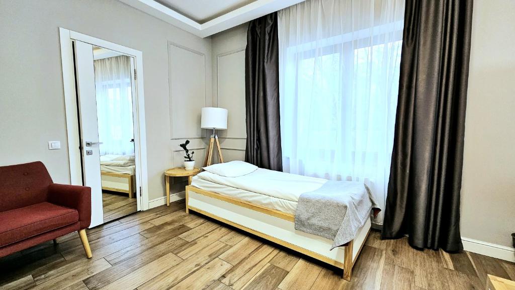 Postel nebo postele na pokoji v ubytování Frapolli 21 Hotel