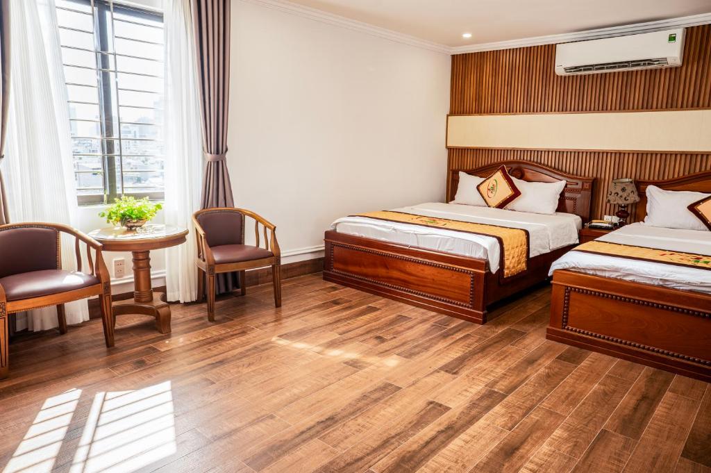 Postel nebo postele na pokoji v ubytování Phu My Hai Hotel