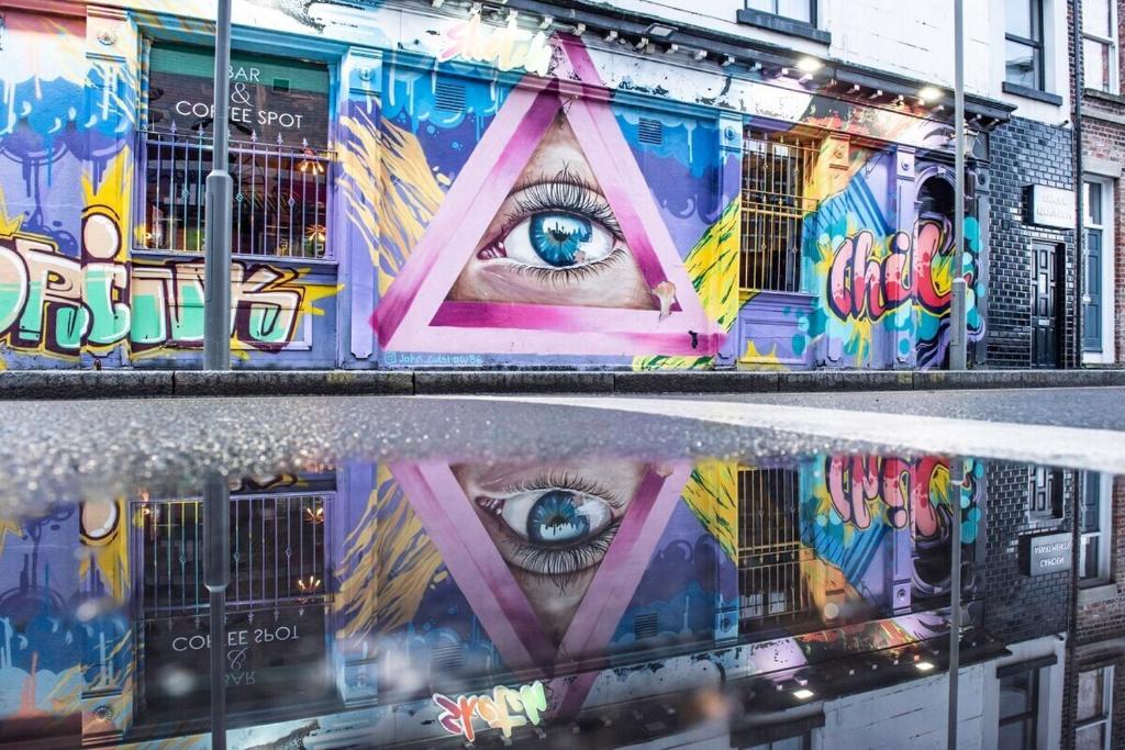 a mural of an eye on the side of a building at Camden Apartments 1 in Liverpool