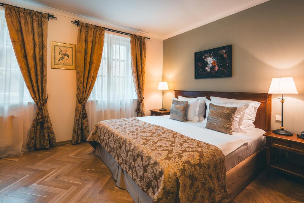 Łóżko lub łóżka w pokoju w obiekcie Appia Hotel Residences