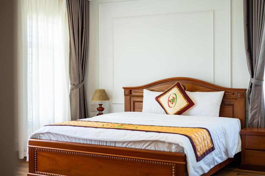 Postel nebo postele na pokoji v ubytování Phu My Hai Hotel