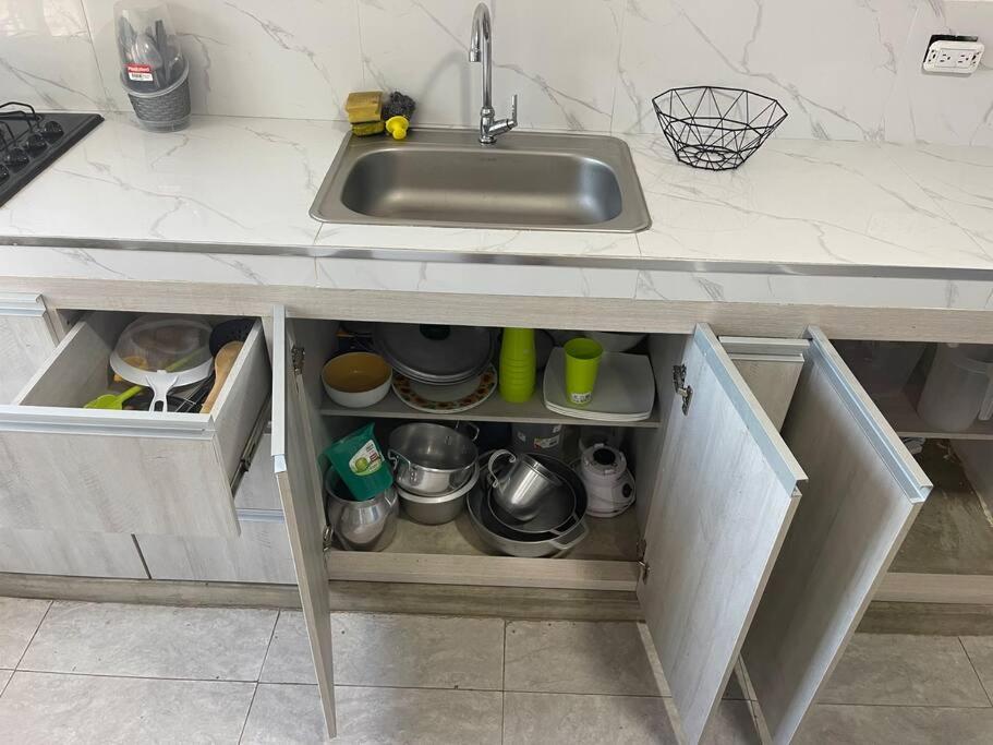 a kitchen counter with a sink and a drawer at Hostal el ebenezeer in Santa Marta