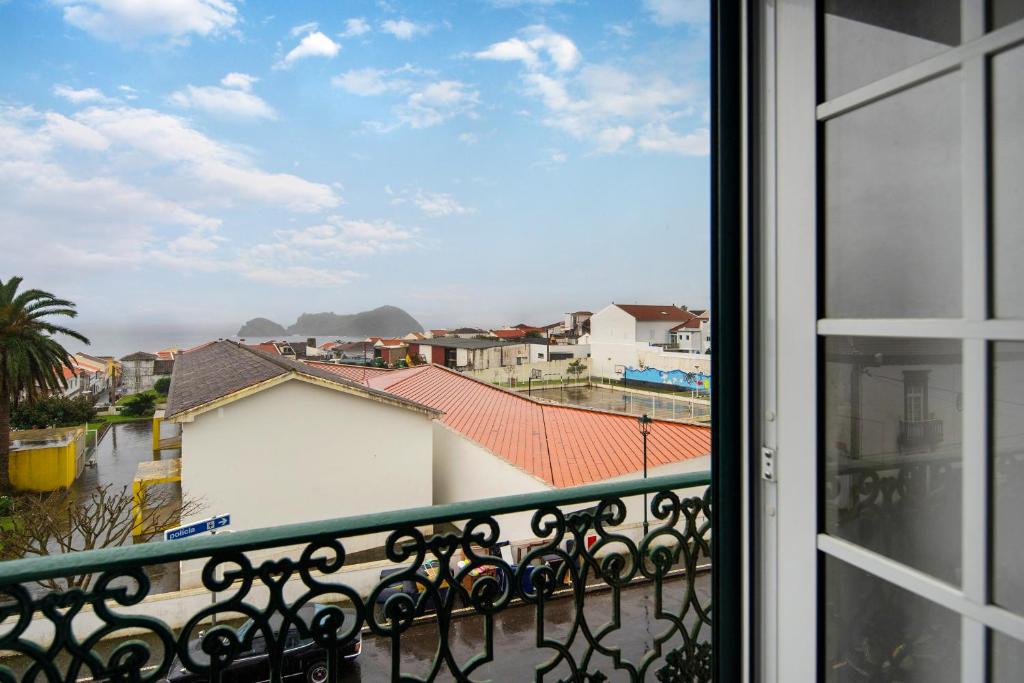 a view of a city from a balcony at Casa São Pedro in Vila Franca do Campo