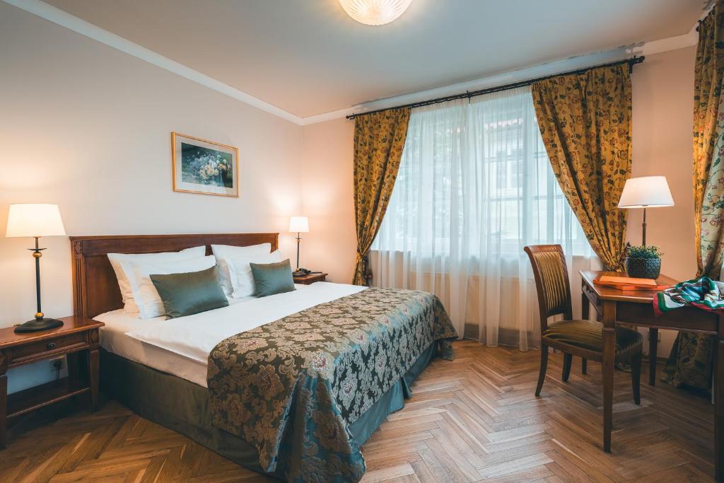 Łóżko lub łóżka w pokoju w obiekcie Appia Hotel Residences