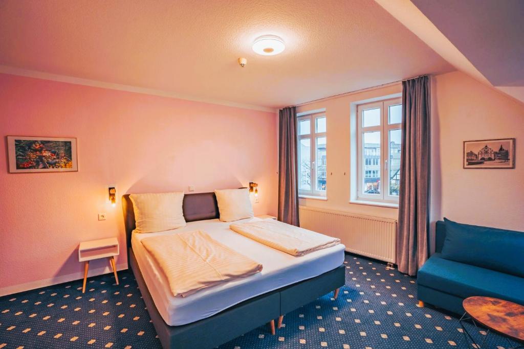 Postel nebo postele na pokoji v ubytování Hotel Starke