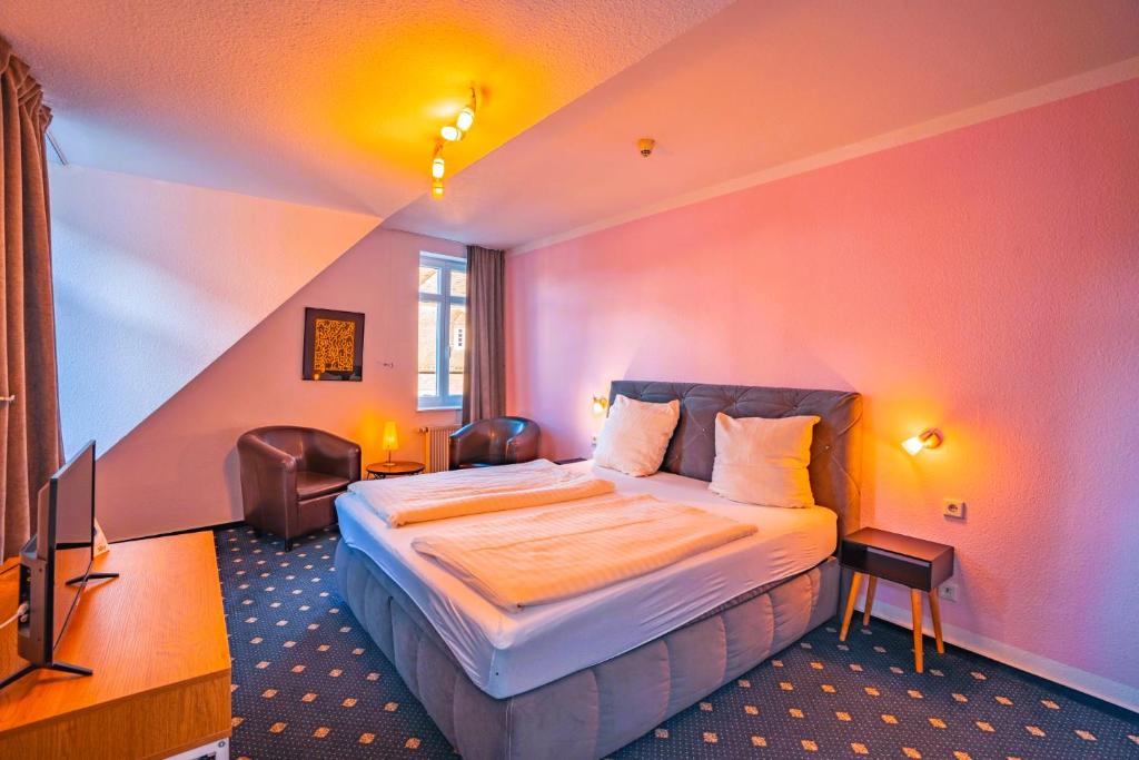 Postel nebo postele na pokoji v ubytování Hotel Starke