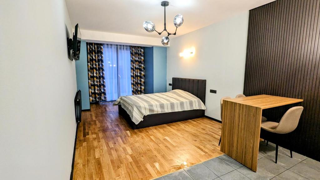 Postel nebo postele na pokoji v ubytování New Gudauri Alpine Charm apartments