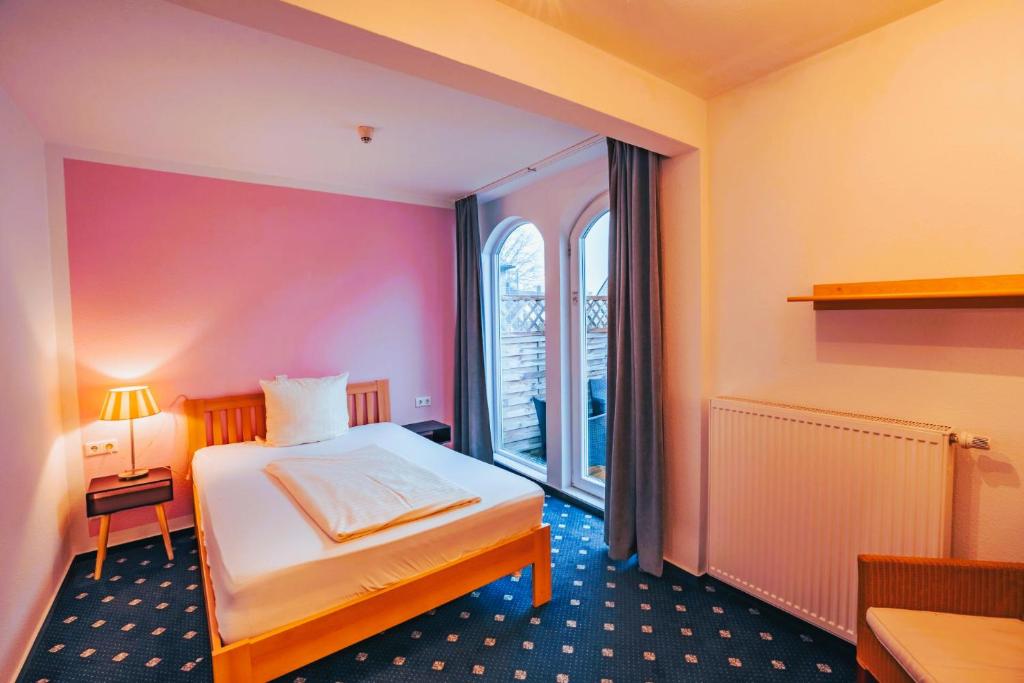 Postel nebo postele na pokoji v ubytování Hotel Starke