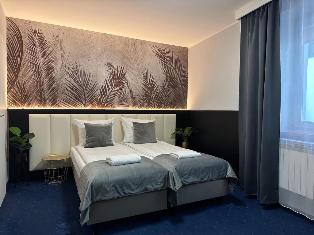 Posteľ alebo postele v izbe v ubytovaní Garbarska 22 Aparthotel