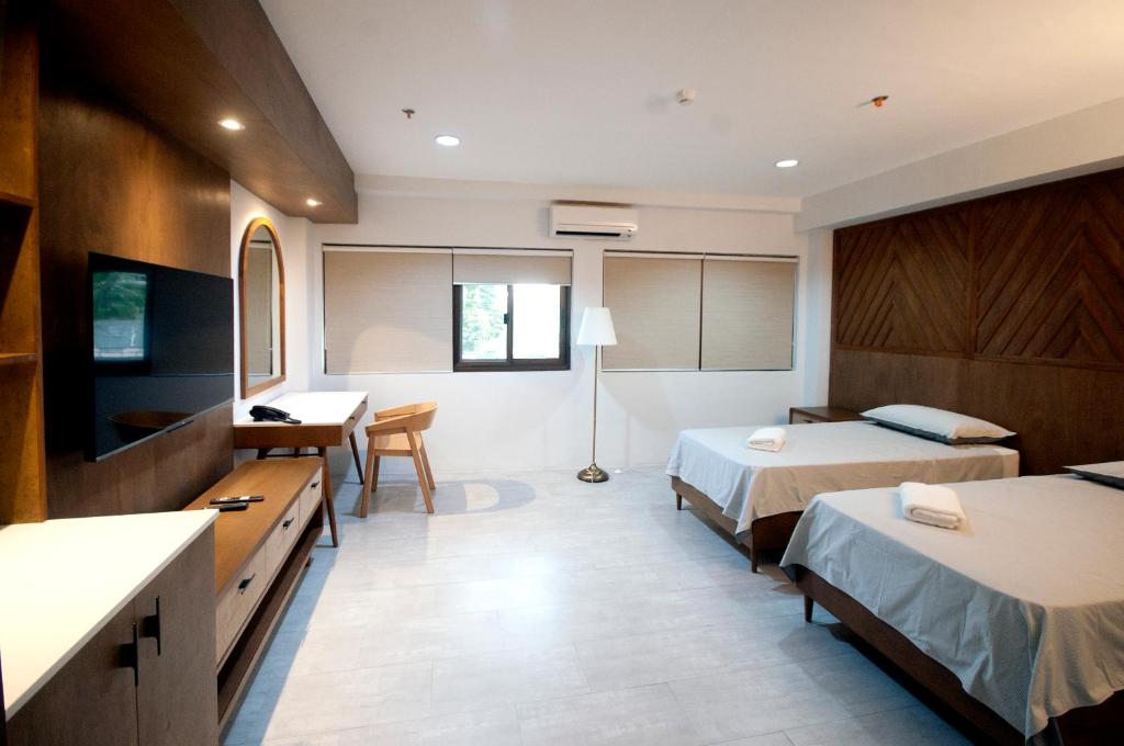 Postel nebo postele na pokoji v ubytování Hotel Lucca