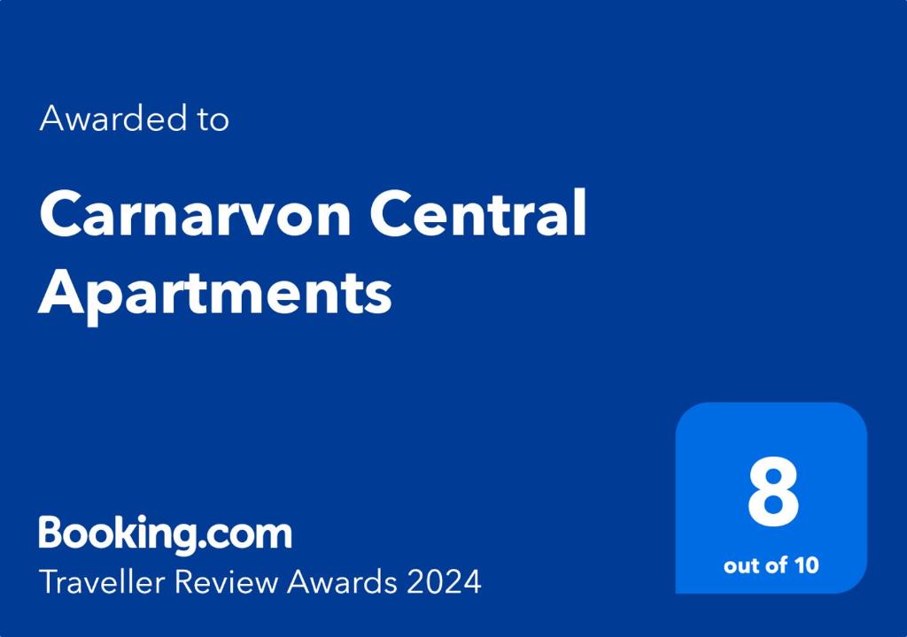 a blue rectangle with the words caravan central apartments on it at Carnarvon Central Apartments in Carnarvon