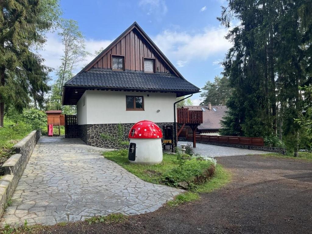 a small house with a red dome in front of it at Chata Matej in Námestovo