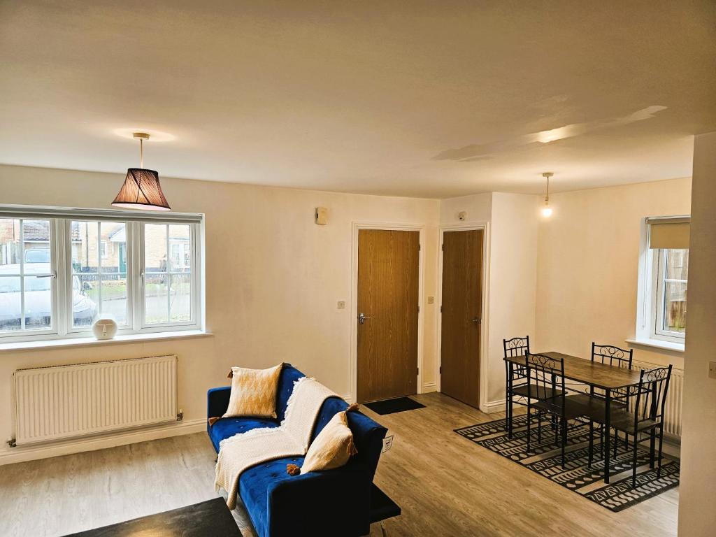 a living room with a couch and a table at Impeccable 2-Bed House in Basildon in Basildon
