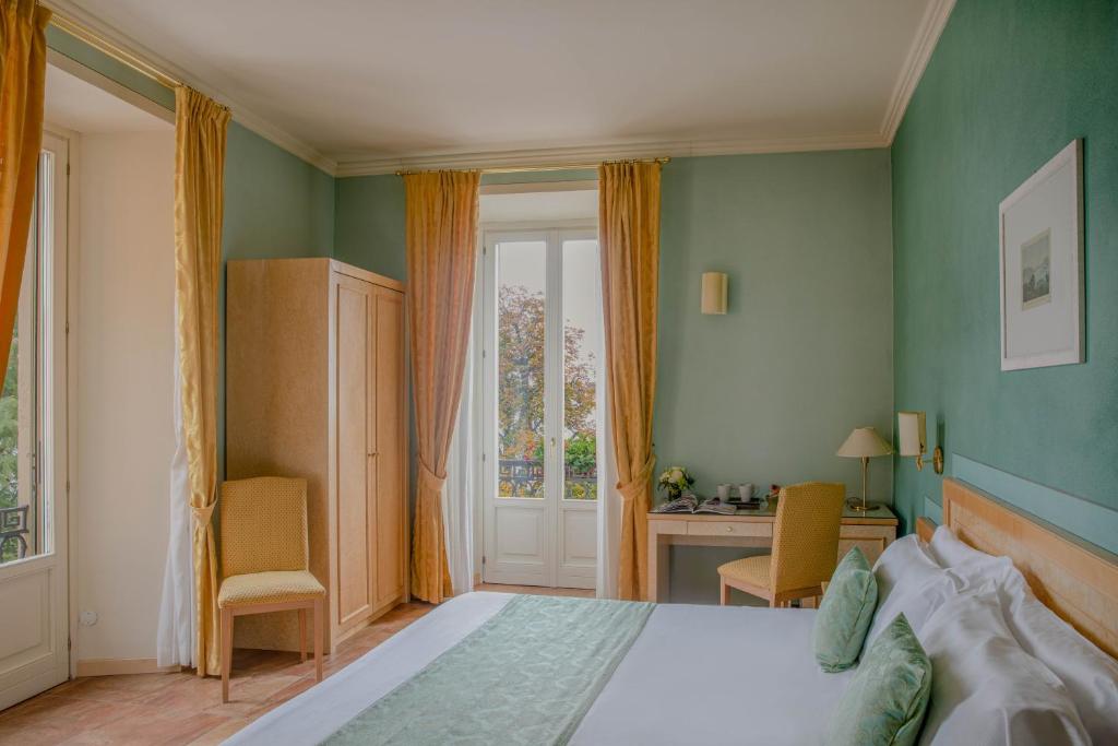 Postel nebo postele na pokoji v ubytování Hotel Belvedere San Gottardo by LVG Hotel Collection