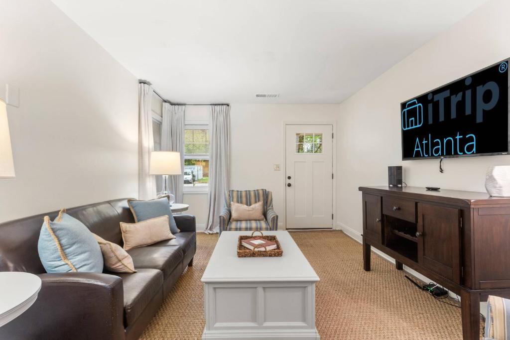 a living room with a couch and a table at Discover Decatur in Decatur