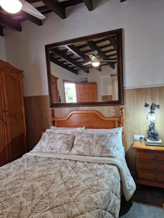 Postel nebo postele na pokoji v ubytování Casa Museo Jerez Centro