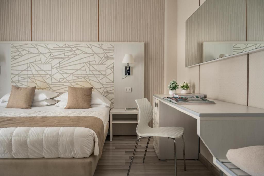 Łóżko lub łóżka w pokoju w obiekcie Grand Hotel Terme & SPA - Chianciano