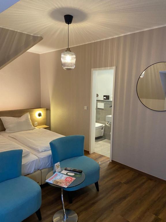 Postel nebo postele na pokoji v ubytování Hotel Feldmann