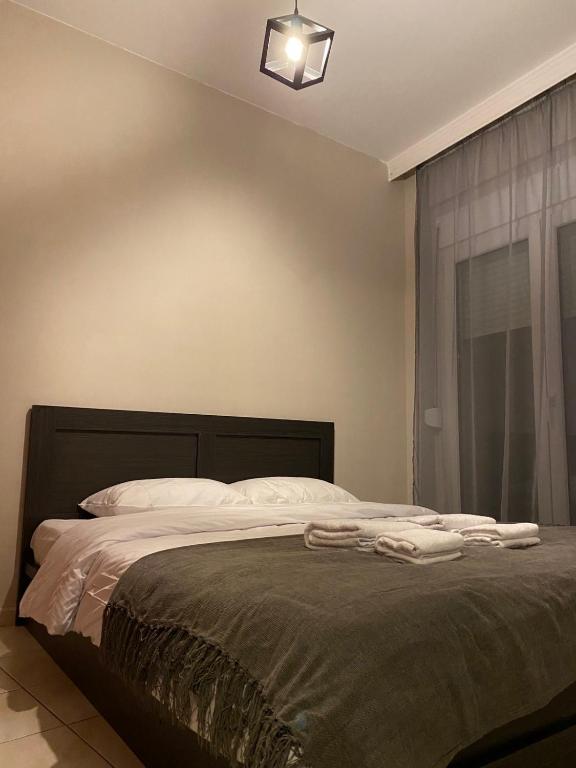 Postel nebo postele na pokoji v ubytování R&K MODERN APARTMENT