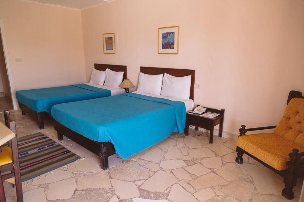 Кровать или кровати в номере Sayadeen Village - Red Sea Riviera