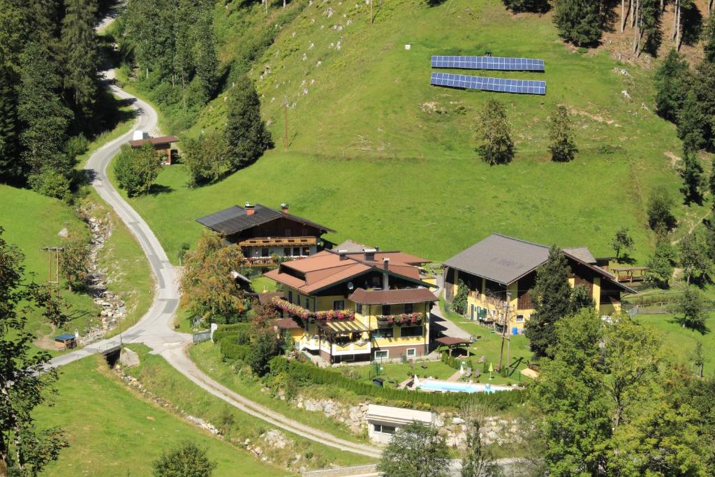 an aerial view of a large house on a hill at Schattaugut in Eben im Pongau