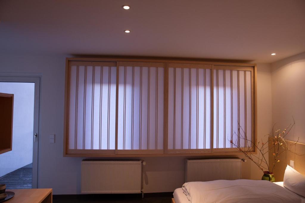 Postel nebo postele na pokoji v ubytování Hotel de Saxe Leipzig
