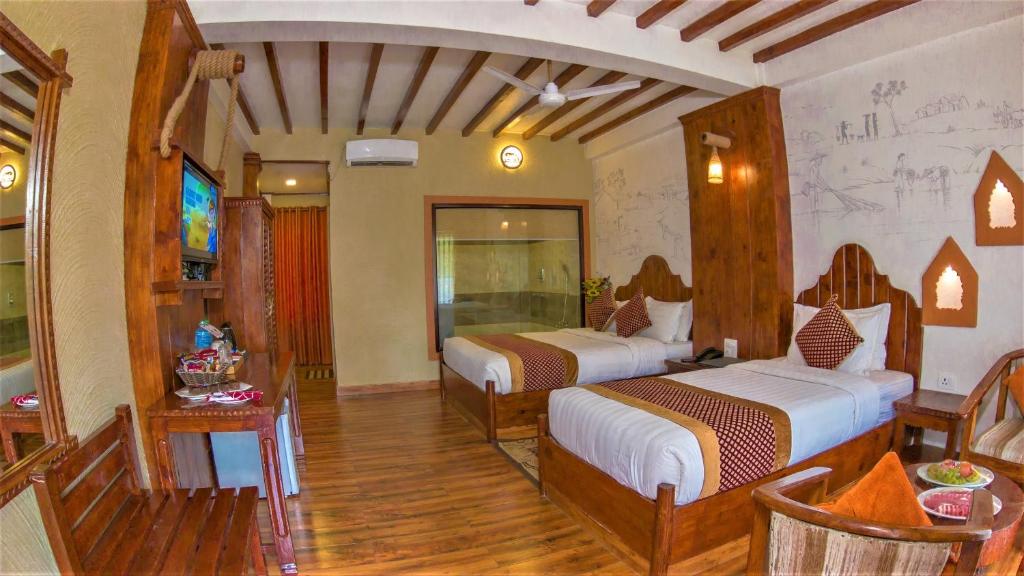 Postel nebo postele na pokoji v ubytování Hotel Jungle Crown