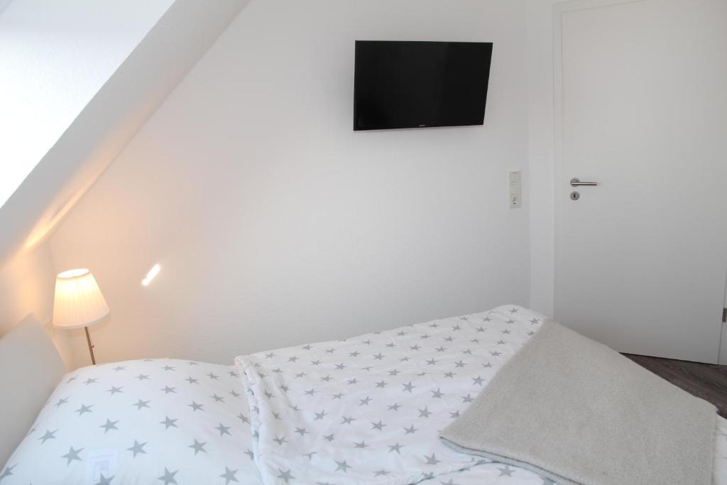 Postel nebo postele na pokoji v ubytování Deichbude