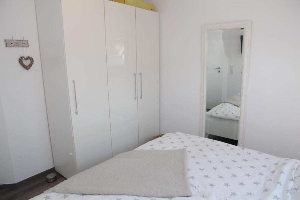 Postel nebo postele na pokoji v ubytování Deichbude