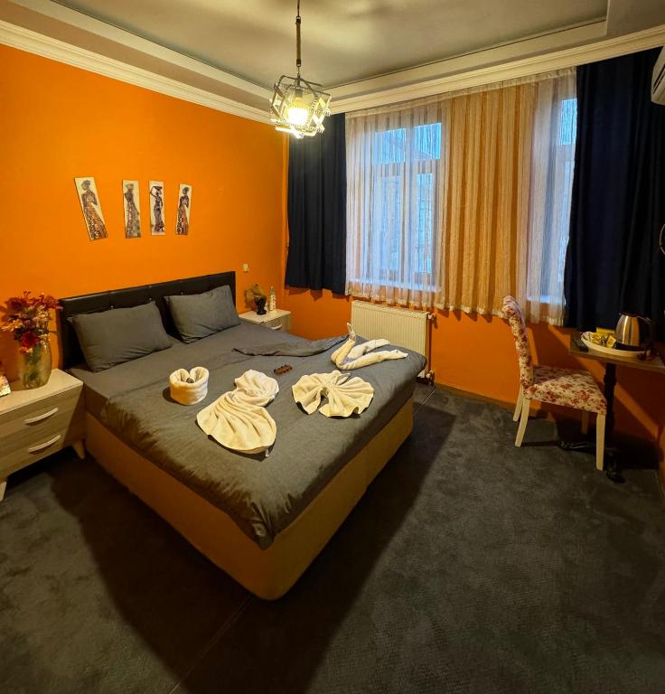 Postel nebo postele na pokoji v ubytování Taksim Pandora hotel