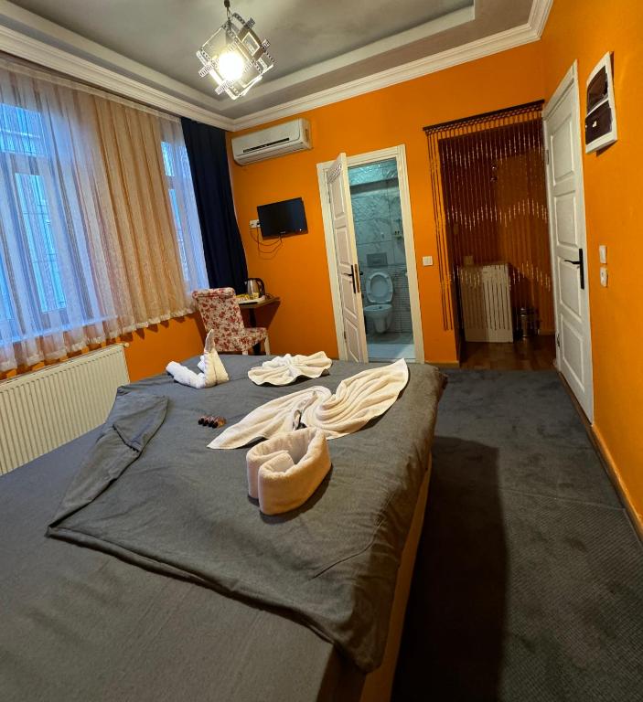 Postel nebo postele na pokoji v ubytování Taksim Pandora hotel